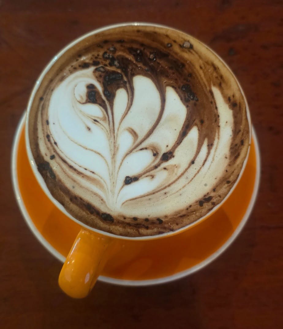 A cappuccino with latte art at the café in Suva